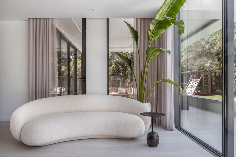 São Paulo Residence curved sofa by the glass